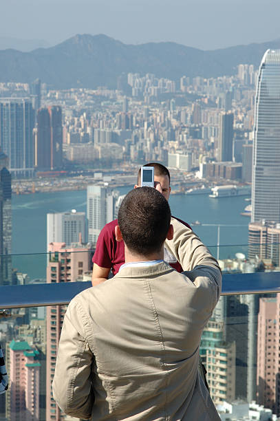 istock Young man taking photo for his friend 91248884