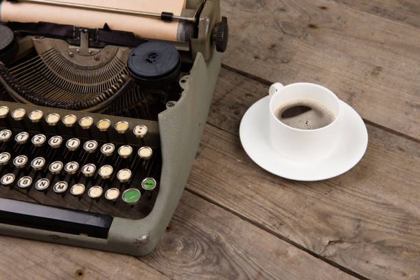 istock Vintage typewriter on the old wooden desk 912490432