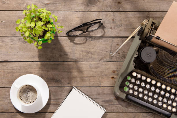 istock Vintage typewriter on the old wooden desk 912491016
