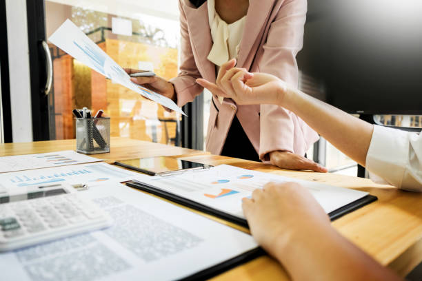 istock Midsection Of Business People Working In Office 912492260