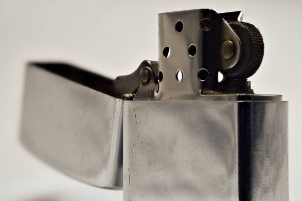 istock Lighter made of steel in open form. Silver color. 912497512