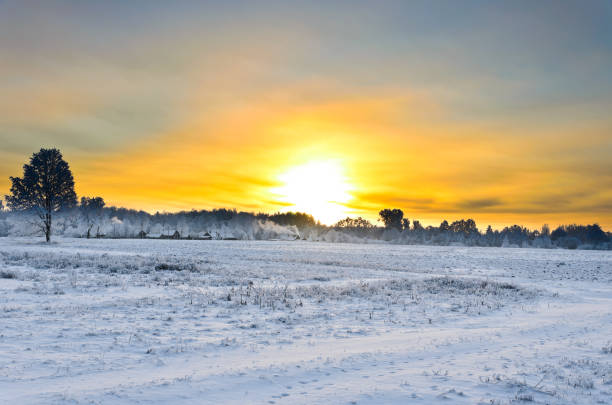 istock Sunrise in winter over the  village 912498660