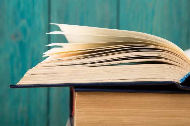 istock Open book on the desk over wooden background 912498672