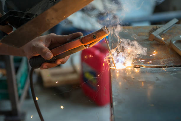 istock The worker welding the metal plate by electric welding  process. 912498800