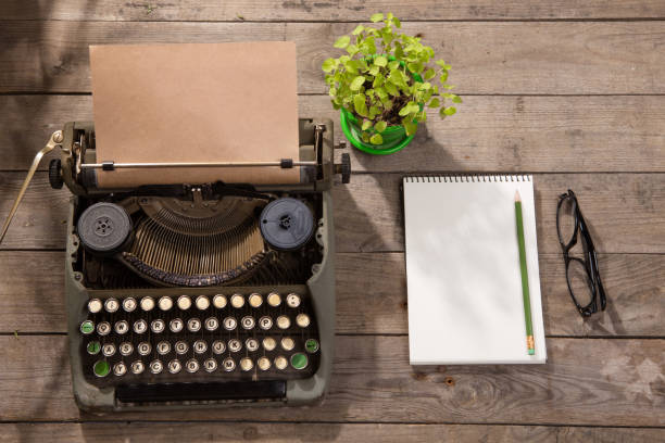 istock Vintage typewriter on the old wooden desk 912498818