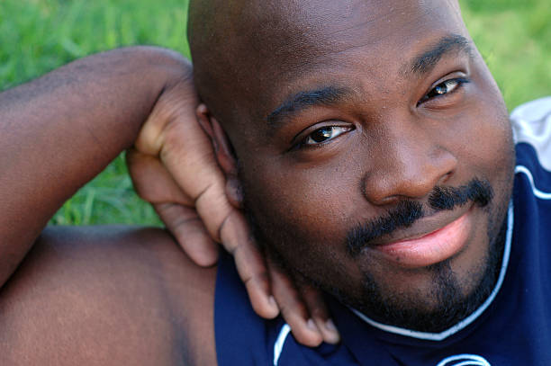 istock Young man relaxing on the lawn 91249983