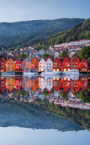 Bergen street at night with boats in Norway, UNESCO World Heritage Site Bergen street at night with boats in Norway, UNESCO World Heritage Site bergen norway stock pictures, royalty-free photos & images