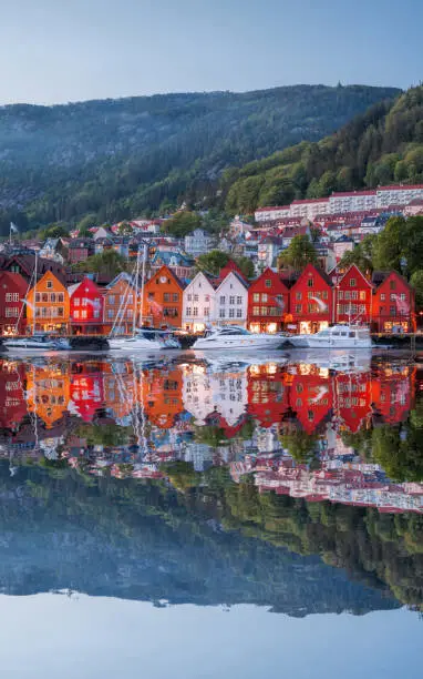 Bergen street at night with boats in Norway, UNESCO World Heritage Site