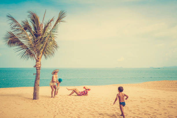 istock Woman with baby on the beach 912501220
