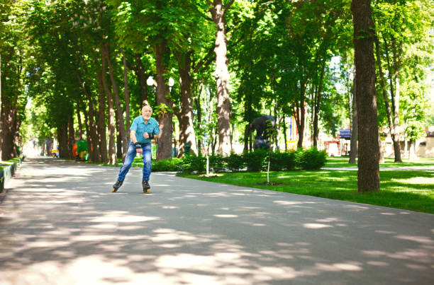 istock Senior man roller skating outdoors 912501572
