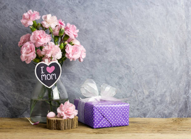 happy mothers day concept of pink carnation flowers in bottle with i love mom letter on heart wood and violet  gift box - flower head bouquet built structure carnation imagens e fotografias de stock