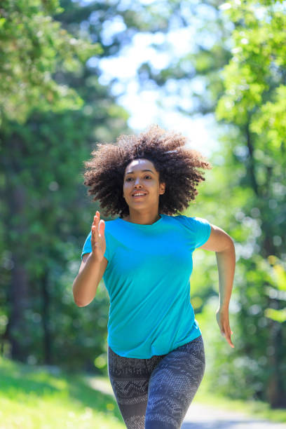 istock African woman jogging in park 912510340
