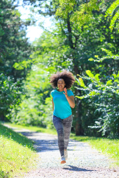 istock African woman jogging in park 912510342
