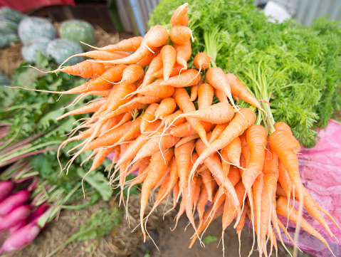 Close up Baby carrots in streen market.