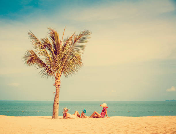 istock Woman with baby on the beach 912510556
