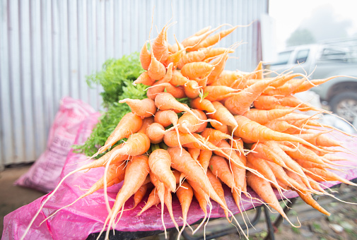 Close up Baby carrots in streen market.