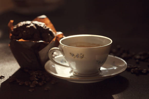 istock Chocolate muffins and coffee on a dark background 912518130