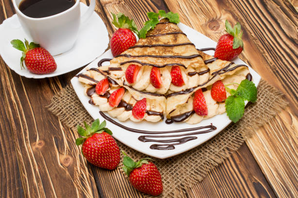 istock Crepes with Banana and strawberries 912534540