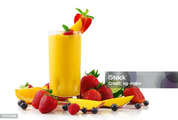 Glass Of Mango Smoothie And Fruits On A White Background Stock Photo - Download Image Now