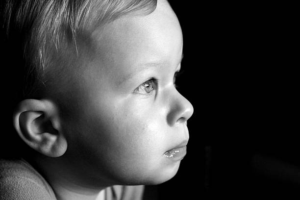 istock Young boy face close-up, profile vue 91253918
