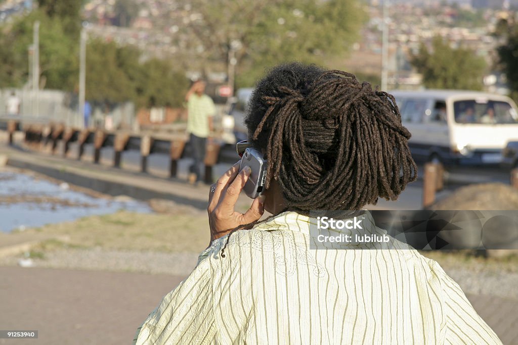 African woman using her mobile phone in Soweto  Africa Stock Photo