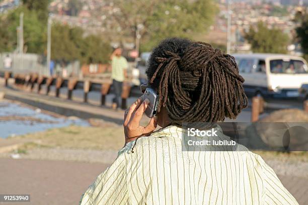 African Woman Using Her Mobile Phone In Soweto Stock Photo - Download Image Now - Africa, Soweto, African Culture
