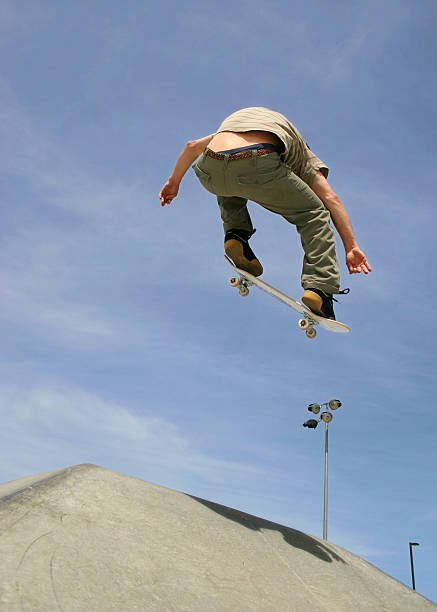 istock High Ollie on a Skateboard at the Skatepark 91254240