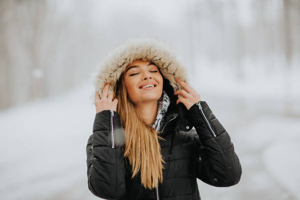 istock Pretty young woman on a winter day 912543438