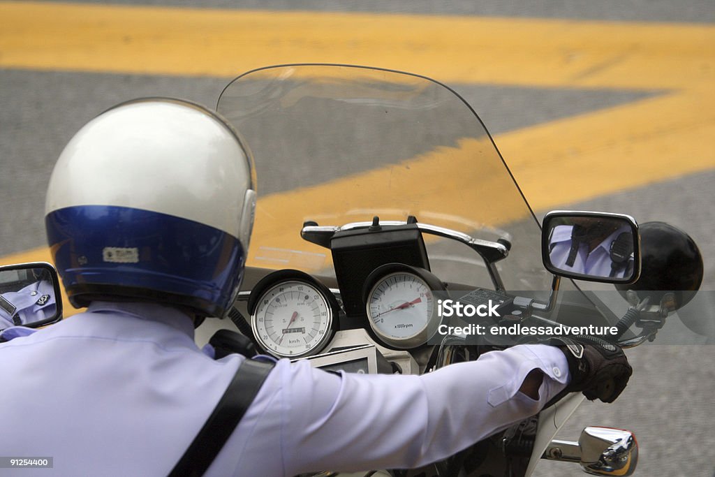 The Police Police office on bike from behind with dials visible Motorcycle Stock Photo