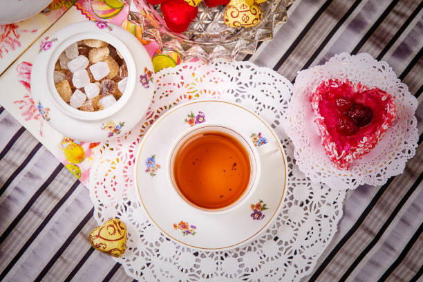 istock Porcelain cup of tea with lemon and sweets 912544342