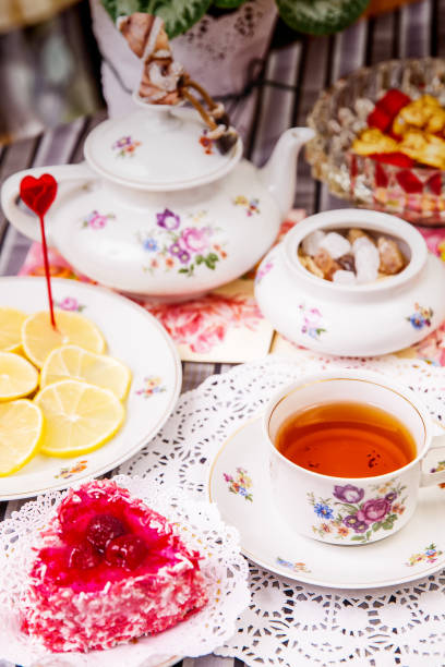 istock Porcelain cup of tea with lemon and sweets 912544464