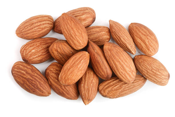 istock almonds isolated on white background close up. Top view 912545330