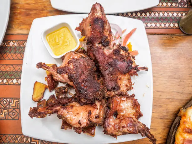 Photo of Traditional fried guinea pig, a popular Peruvian cuisine.