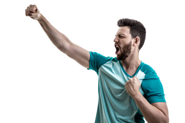 istock Fan / Sport Player on green uniform celebrating 912552268