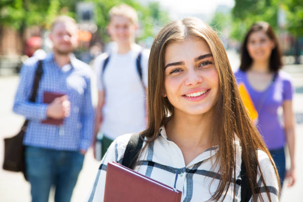 istock Female students outdoors with her friends 912552616