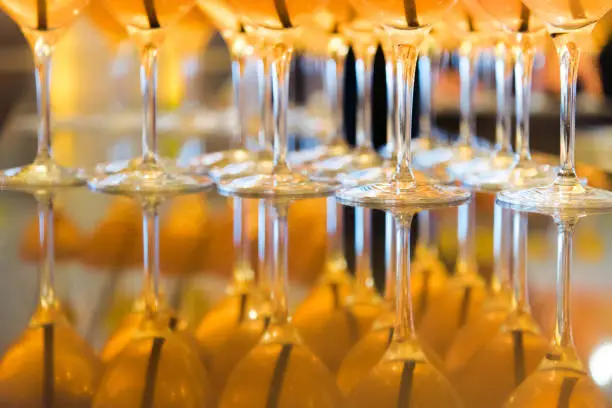 Photo of Alcohol bar, cocktail glass on bar counter, cocktail glass in a bar, Drinking cocktail in bar, cocktail in the glass with straws, Fresh drink coctail on a color background