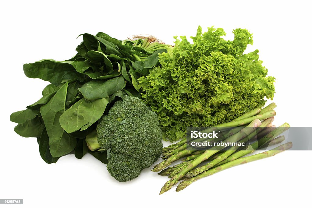 Eat Your Greens Eat your greens ~ spinach, broccoli, curly lettuce and asparagus.  Healthy eating. Antioxidant Stock Photo