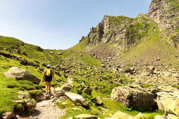 istock mature woman hiking in the Pyrenees mountains 912561268