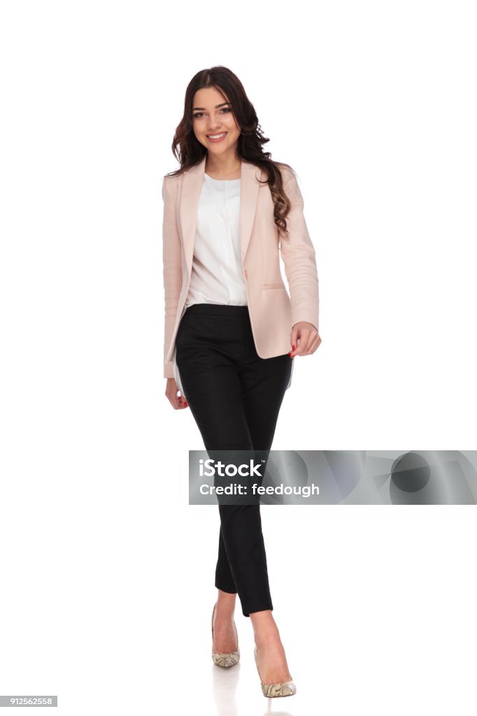 young smiling business woman is walking forward young smiling business woman is walking forward on white background Women Stock Photo