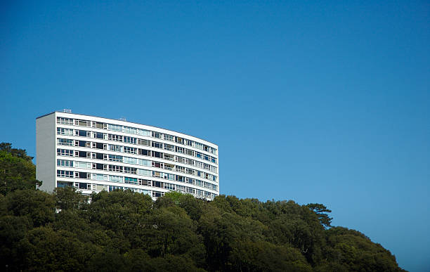 istock Curving Condominium Apartment Block on Green Hill 91256301