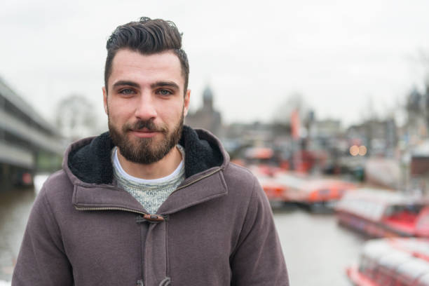 Horizontal color image of a real life Syrian refugee in Amsterdam. Copy space right.