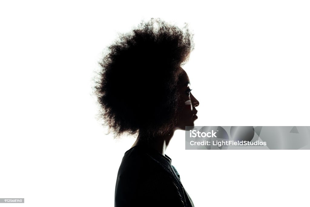 silhouette of african american woman with afro hairstyle isolated on white In Silhouette Stock Photo