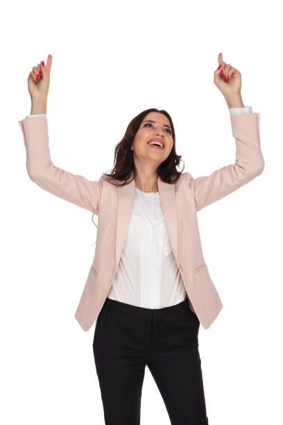 istock laughing woman celebrates and points fingers up 912569766