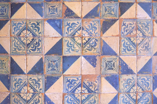 istock Ancient wall of patchwork pattern from colorful Moroccan, Portuguese tiles, Valencian, Tile, ornaments, Surface textures. 912570144