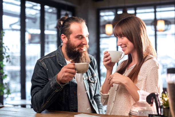 istock Couple having coffee at cafe 912578502