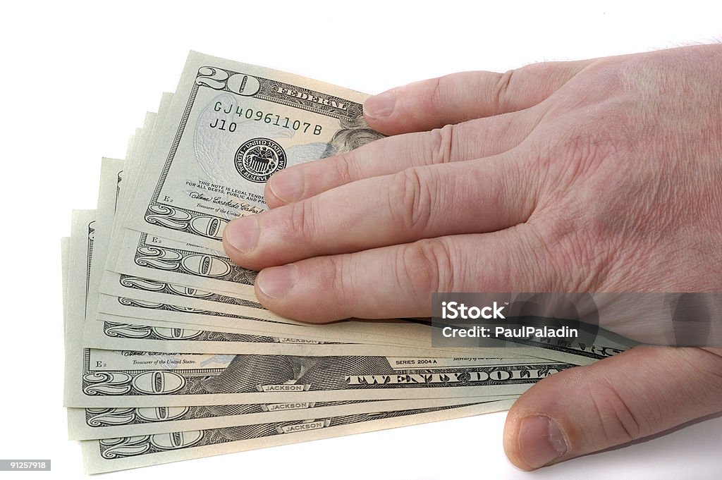 male hand over dollars  Accidents and Disasters Stock Photo