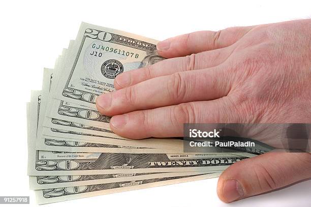 Male Hand Over Dollars Stock Photo - Download Image Now - Accidents and Disasters, Close-up, Coin