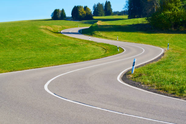 Country road with curve in s shape in the Black Forest without cars and traffic