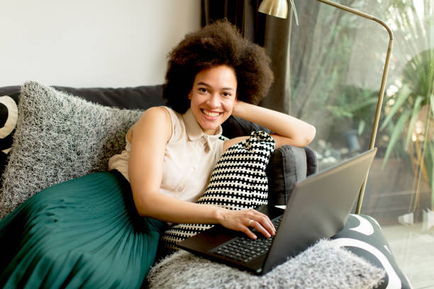 istock Young african american woman web-surfing internet 912579248