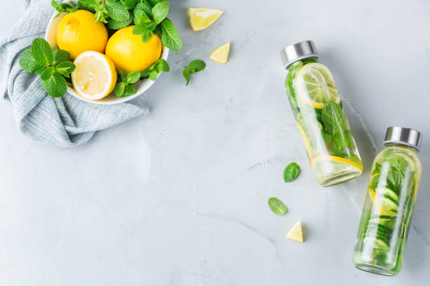 Fresh cool lemon cucumber mint infused water detox drink stock photo